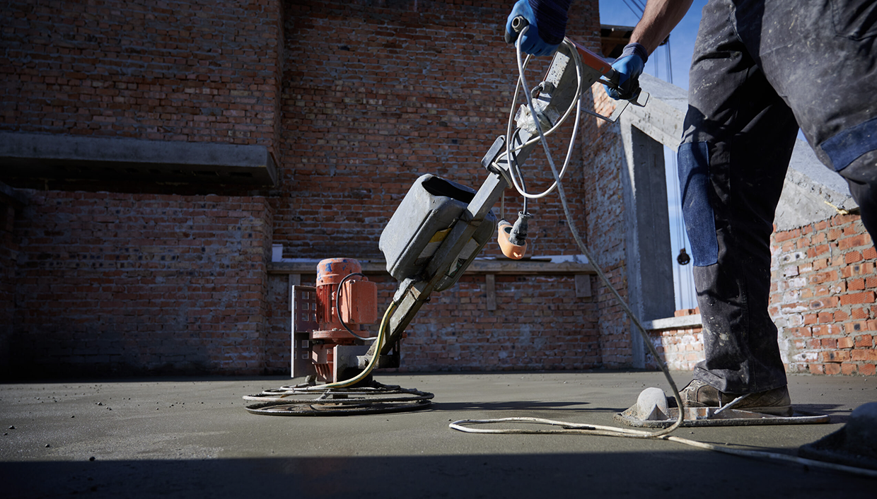 Aggregate delivery and placement in action at a construction site